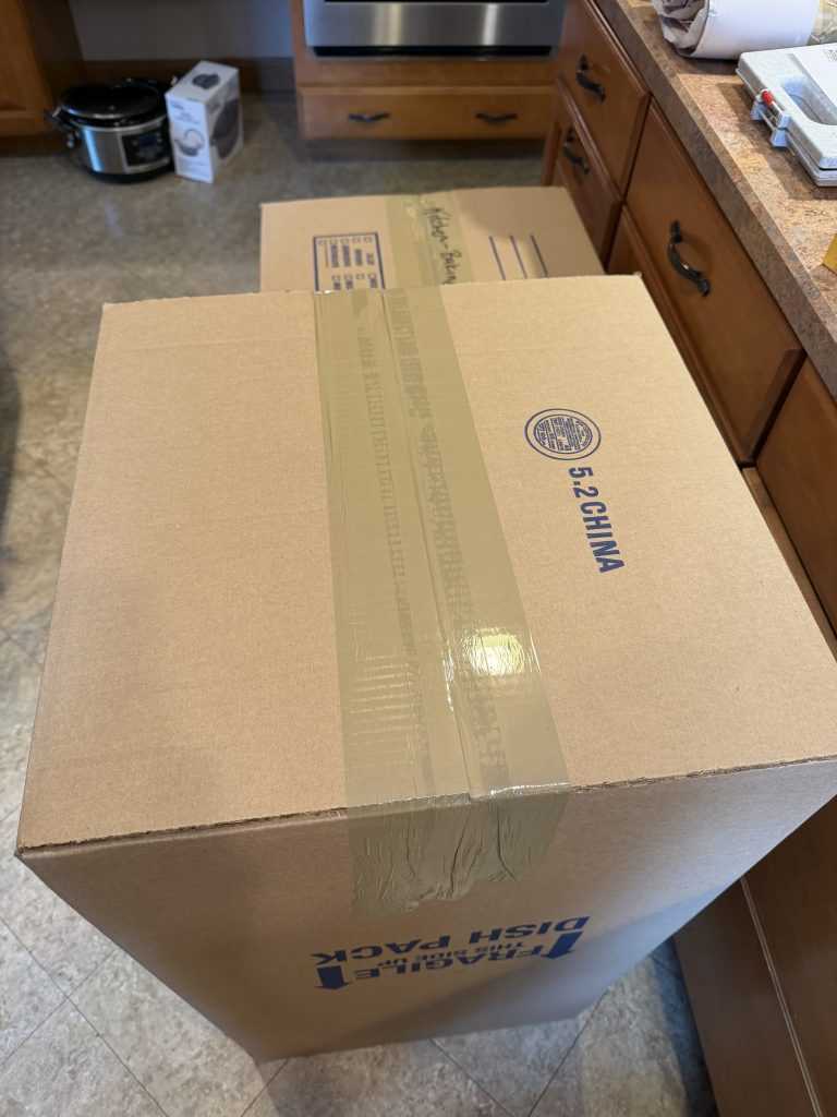 How to pack for a move — dish-pack box sealed with three overlapping strips of tape, Aron Movers